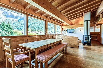 A wooden table and chairs in a living room