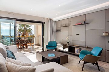 A living room with a couch a chair and a coffee table