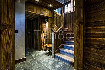 A wooden staircase with the word tempo on the bottom