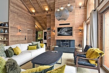 A living room with a couch and chairs and a fireplace