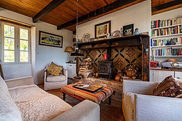 A living room with a fireplace and a couch