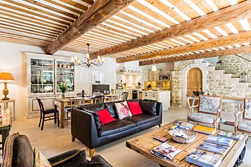 A living room with a couch and a table with magazines on it