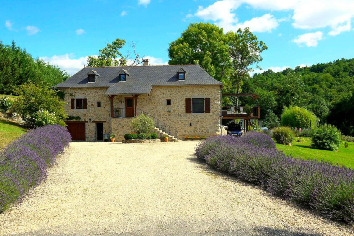 A house with purple flowers in front of it