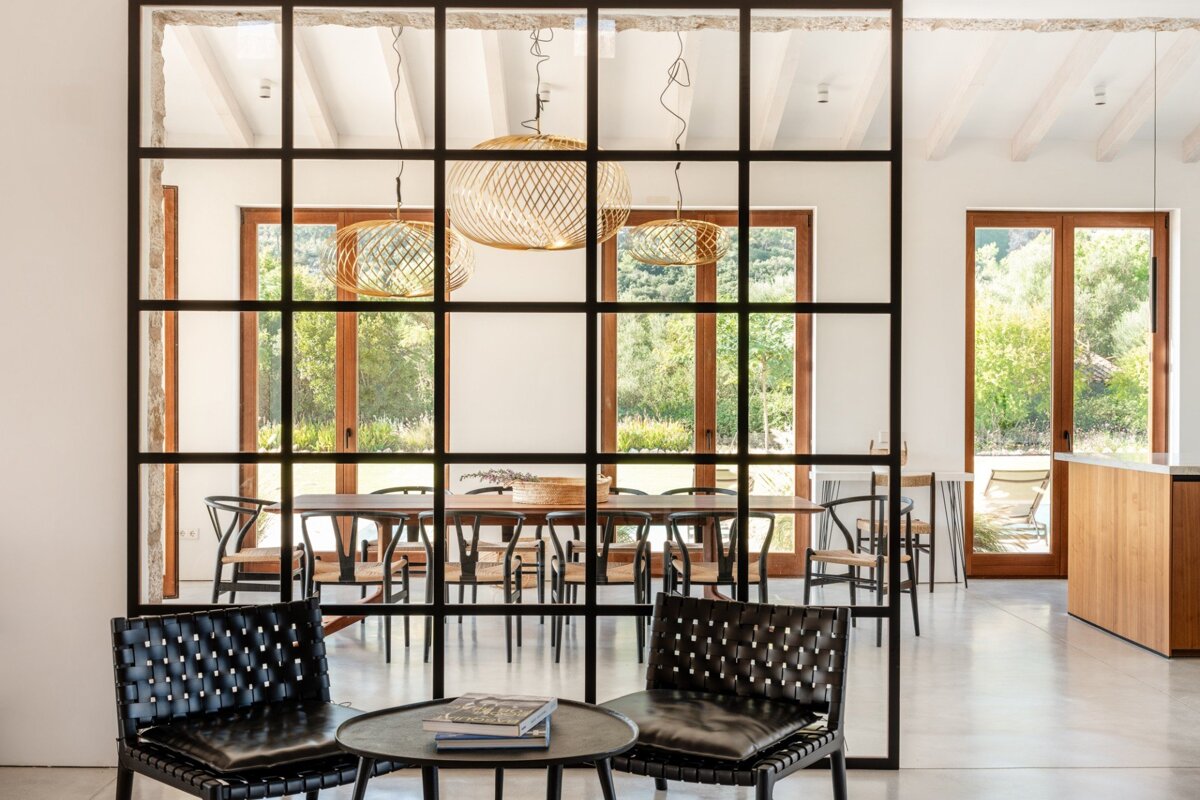 A room with chairs and a table with a book on it