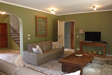 A living room with a couch and a television