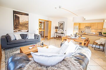 A living room with a couch and a coffee table