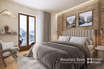 A bedroom with a large bed and a knight frank logo
