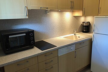 A kitchen with a dishwasher that says ' bosch ' on it