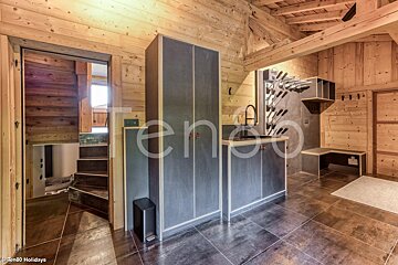 A picture of a wooden house with the word holidays on the bottom
