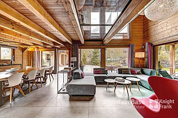 A living room with a couch and chairs and a sign that says mountain base knight frank