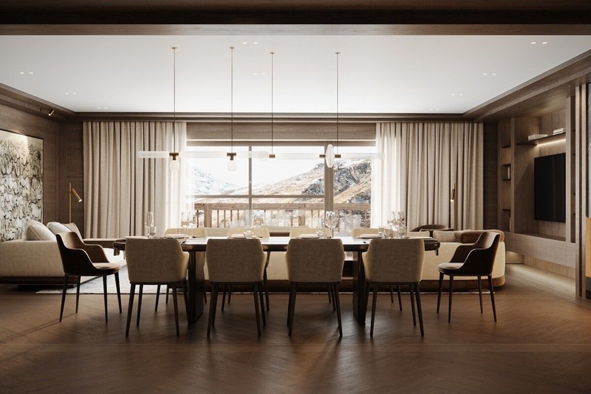 An elegant open-plan living and dining space with a scenic mountain view, modern lighting, neutral decor, and dark wood finishes.