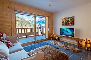 A living room with a couch and a flat screen tv