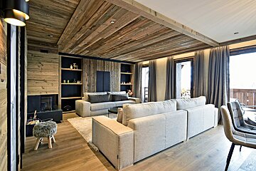 A living room with a couch and a fireplace