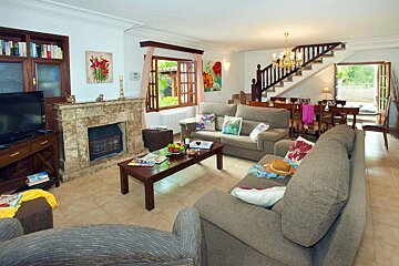 A living room filled with furniture and a fireplace