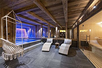 A room with a hammock hanging from the ceiling