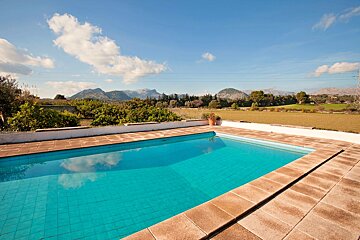 A large swimming pool with mountains in the background