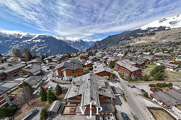 An aerial view of a small town with the letters vip visible