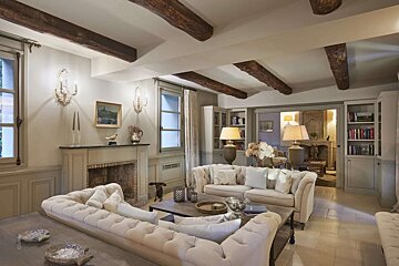 A living room filled with furniture and a fireplace