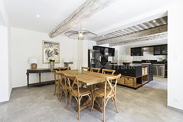A dining room with a table and chairs and a sign that says knight frank