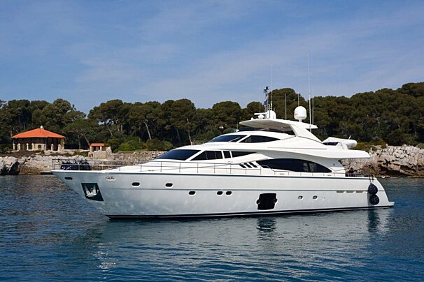 A large white yacht is floating in the water