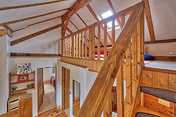 A wooden staircase leading to the second floor of a house