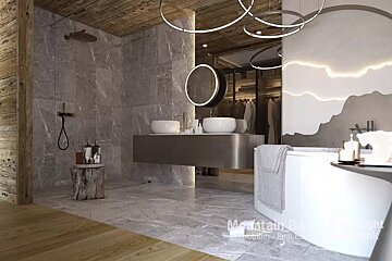 A modern luxury bathroom with marble tiles, wood ceiling, double vanity, shower, and tub with a subtle mountain mural. A walk-in closet is visible.