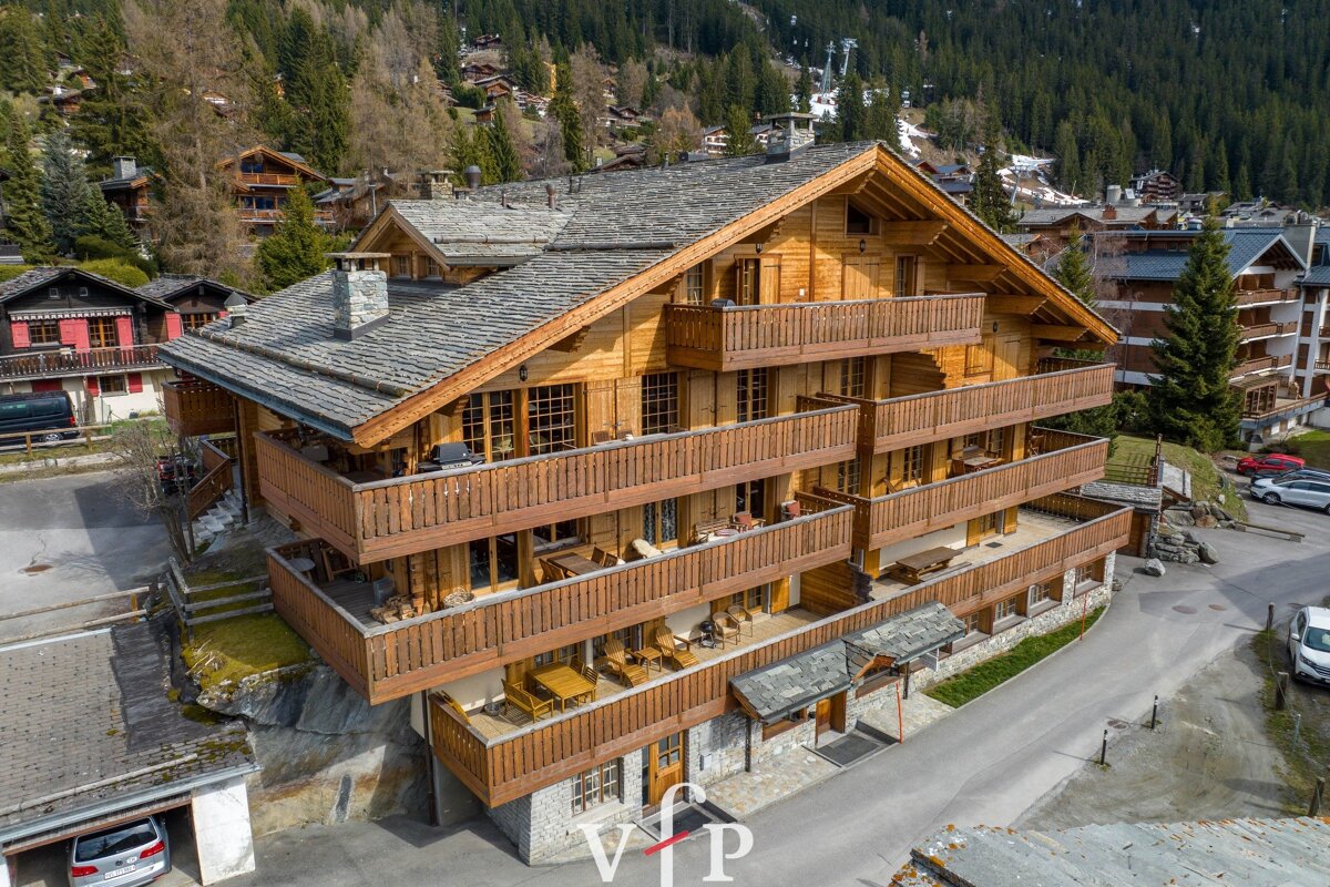 A large wooden building with a vip logo on it