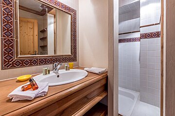 A hallway leading to a bedroom with a bunk bed