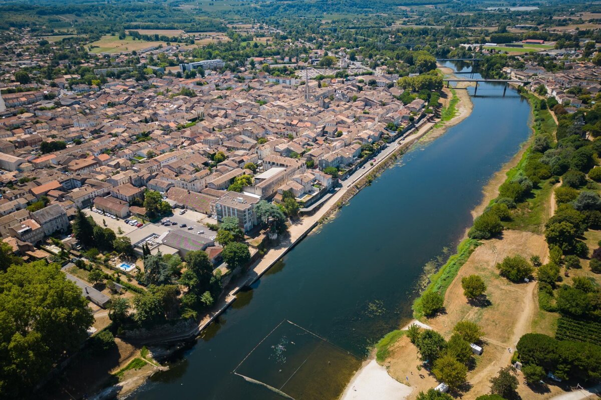An aerial view of a city with a river running through it