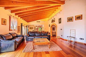 A living room with two leather couches and a coffee table