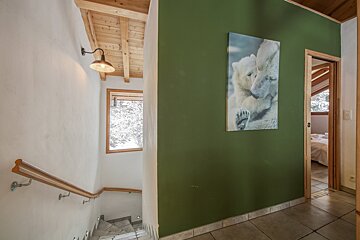 A green wall with a picture of a polar bear on it