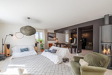 A living room filled with furniture and a fireplace
