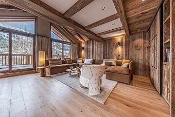 A living room with a couch and a chair