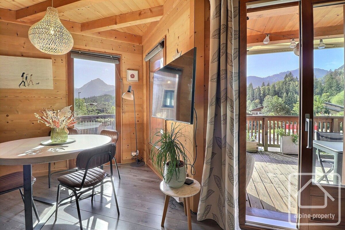 A dining room with a table and chairs and a sign that says cabine property