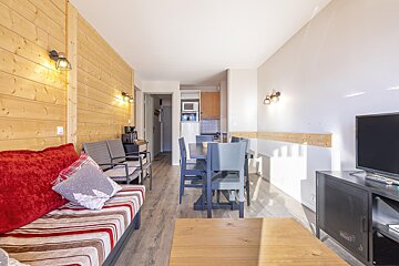 A living room with a couch and a television