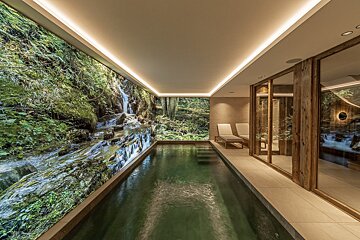 A living room with a couch and a flat screen tv