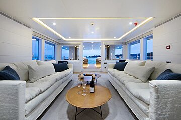 A bottle of wine sits on a table in a living room