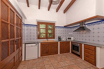 A kitchen with a dishwasher and a microwave