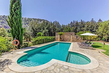 A large swimming pool with a life preserver on the side