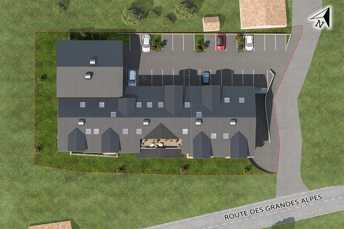 An aerial render of a modern building complex with gray roofs, a parking lot with cars, surrounding green lawns, and a road (Route des Grandes Alpes).
