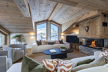 A living room with a fireplace and a couch