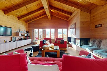 A living room with a fireplace and a flat screen tv