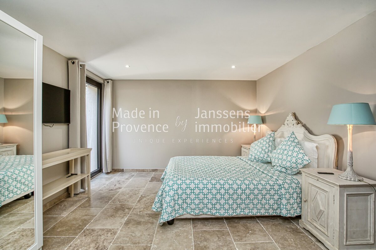 A bedroom with the words made in provence on the wall
