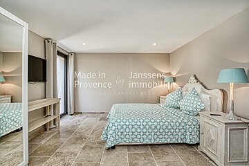 A bedroom with the words made in provence on the wall