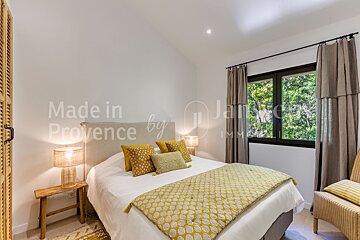 A bedroom with the words made in provence by written on the wall
