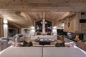 A living room with a fireplace and a couch