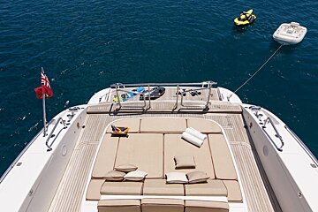 A jet ski is floating in the water near a boat