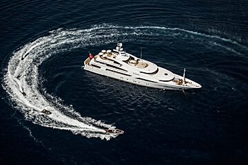 A large white yacht with the name sahara on the side
