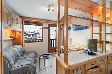 A living room with a couch and a bag that says glacier