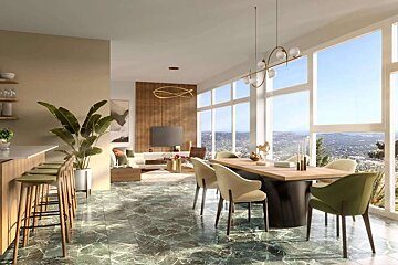 Stylish open-concept living/dining space with green marble floors, a bar, modern furniture, and expansive windows showcasing a scenic mountain view.
